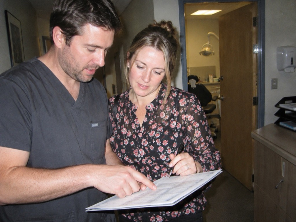 Two of the team reviewing the day’s schedule in the corridor